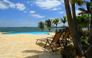 chairs on pool patio on the bay