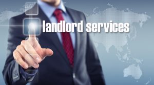 Man clicking on a screen and the words landlord services