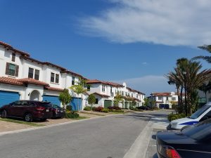 centra falls townhouse row with blue garage doors