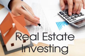Real Estate Investing photo shows calculator