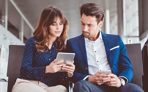 first time home buyers couple looking at tablet